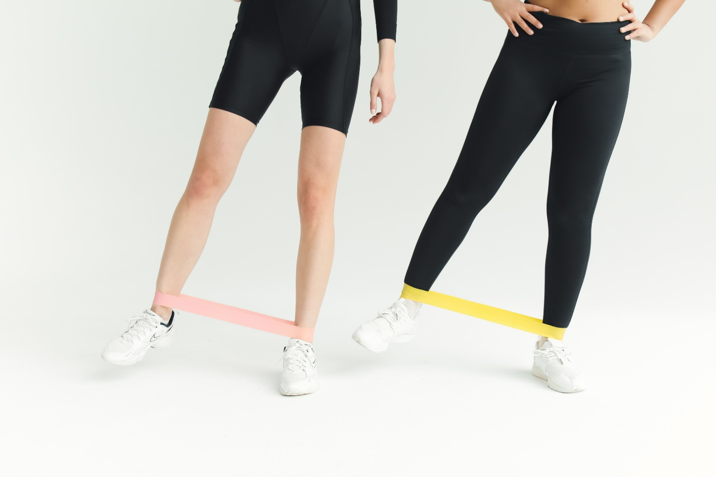 Two people using resistance bands