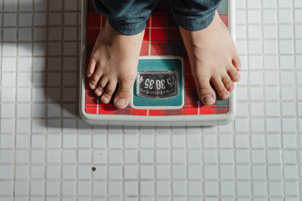 A person checking their weight
