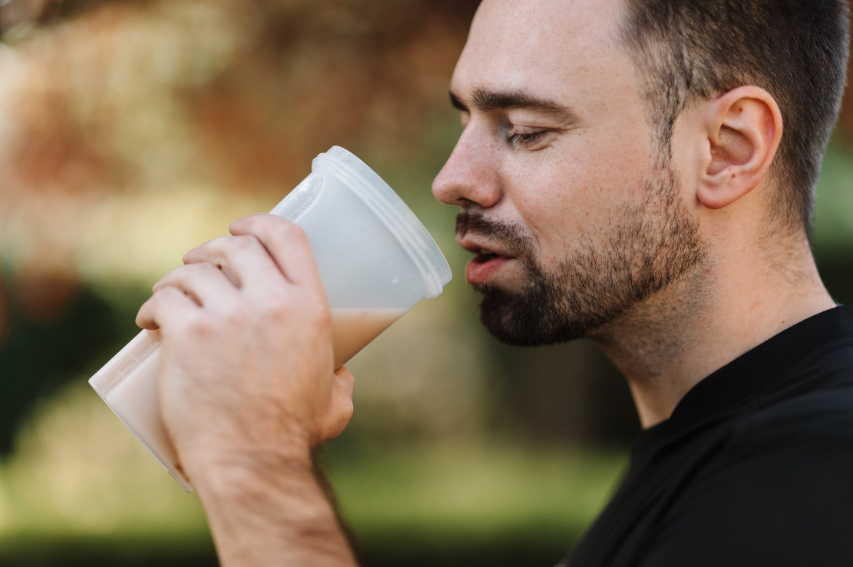 Man drinking a protein shake.