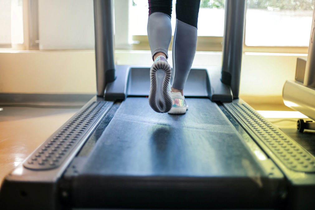 Close-up of a person running on a treadmill